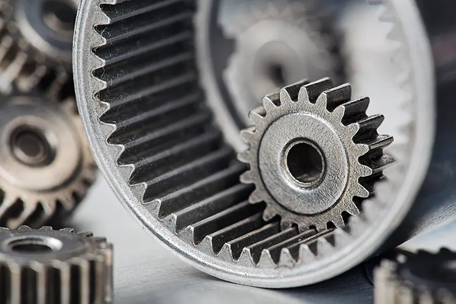 Planetary gears offer high torque density, while spur gears provide efficiency